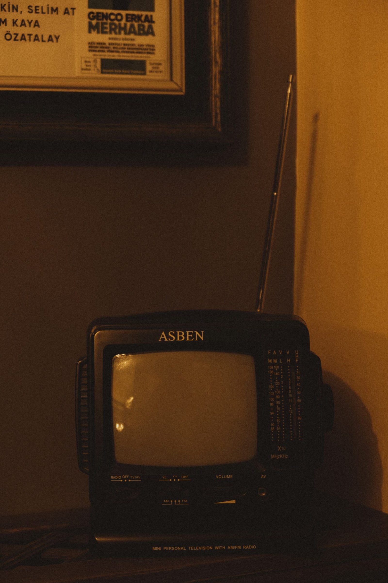 a small television sitting on top of a wooden table